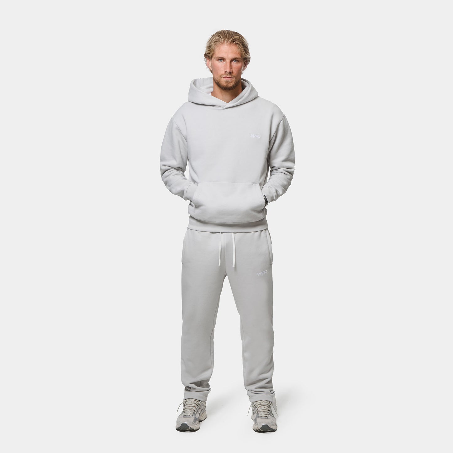 Model Posing to the camera wearing his Ice Grey Tracksuit, front view